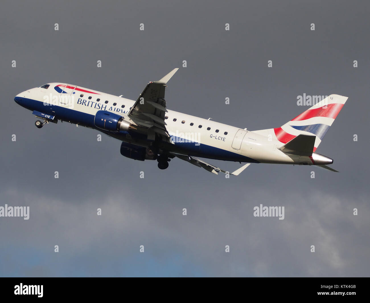 BA CityFlyer G LCYE Embraer 170 175 takeoff from Polderbaan, Schiphol (AMS   EHAM) at sunset, pic2 Stock Photo