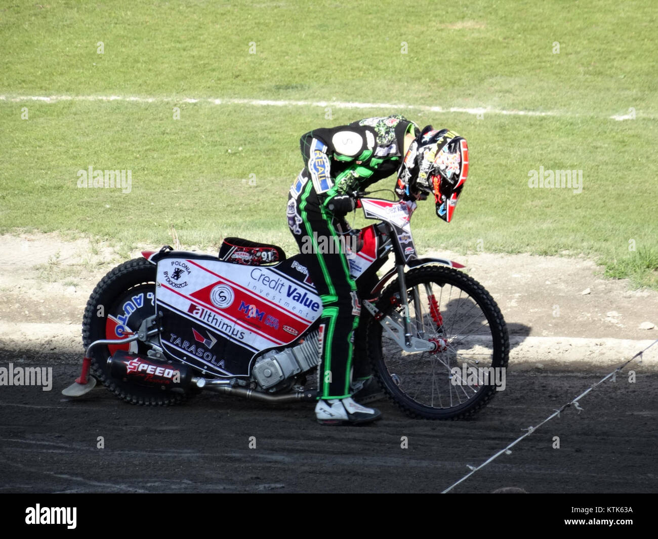 The image depicts the Bdg Polonia stadium in Zuzel, Poland, on May 14, 2015, showcasing a sporting event or gathering at the venue. Stock Photo