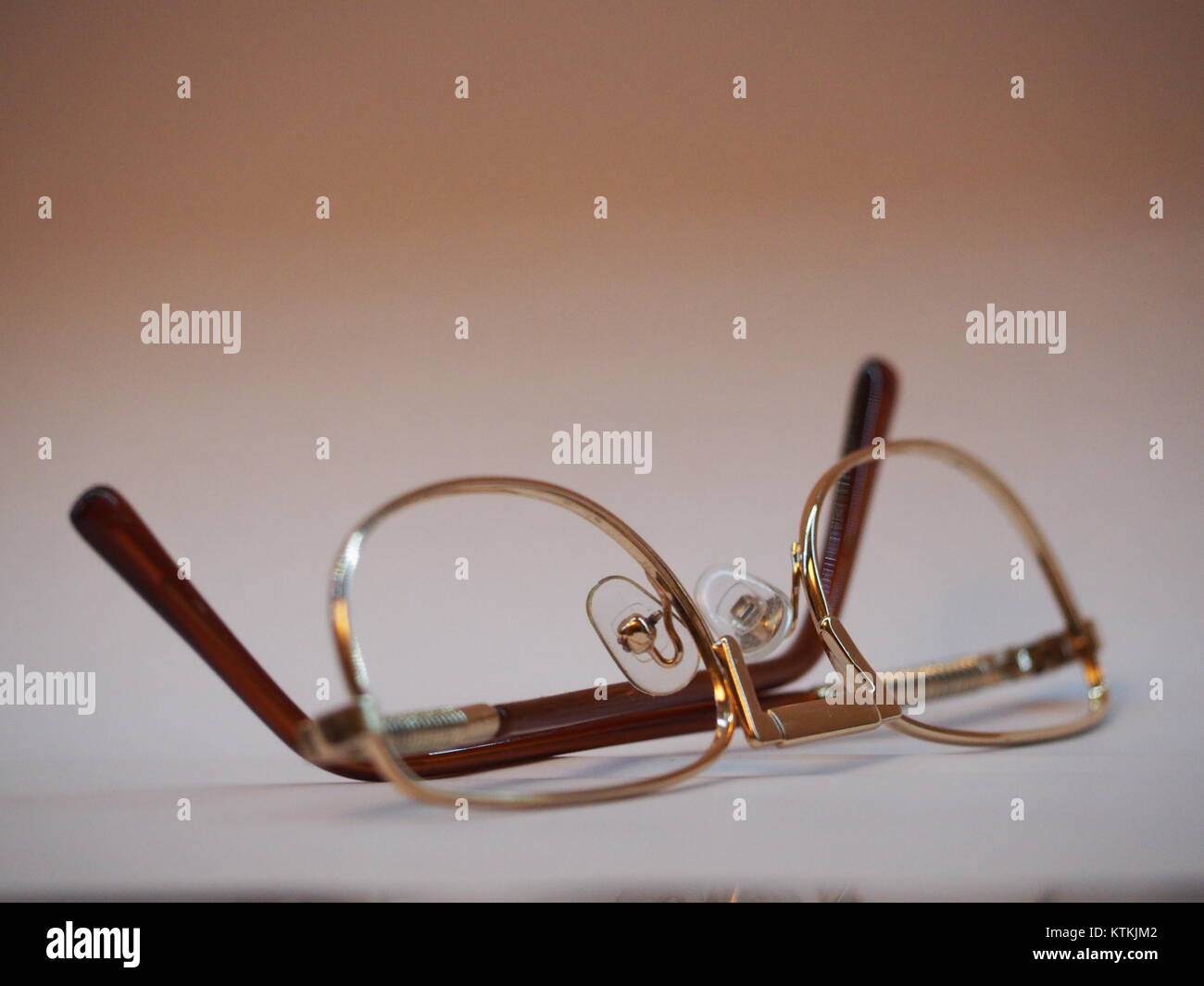 An optical golden brown glasses without the lenses on natural background Stock Photo Alamy