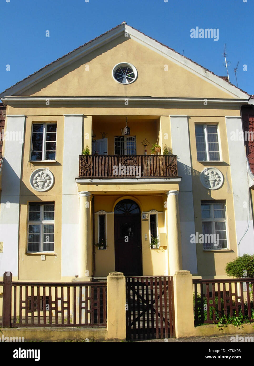 This image depicts the building at Wyspianskiego 6, located in an urban setting. It highlights the architectural style and design of the structure. Stock Photo