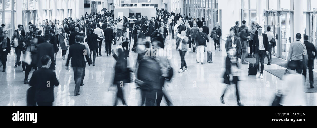 crowd of Blurred business people at a trade fair floor Stock Photo