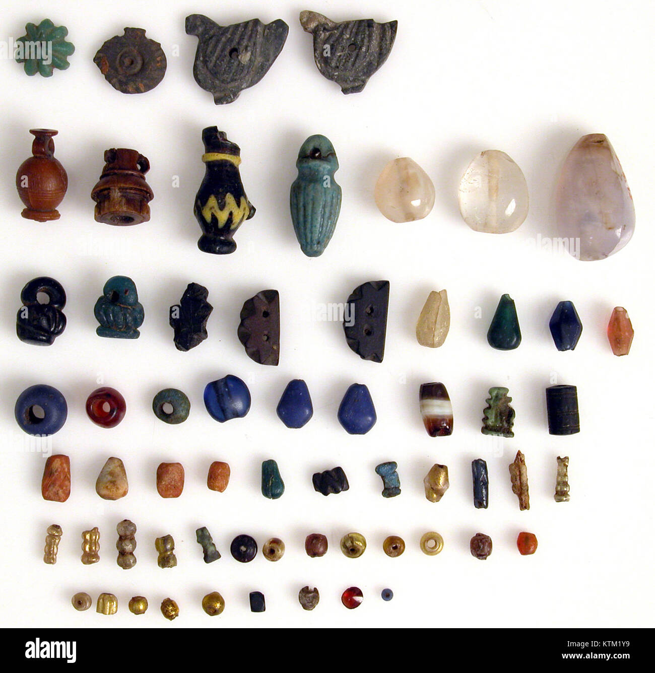Amulet Examples A collection of beads and amulets, showcasing their historical and ...