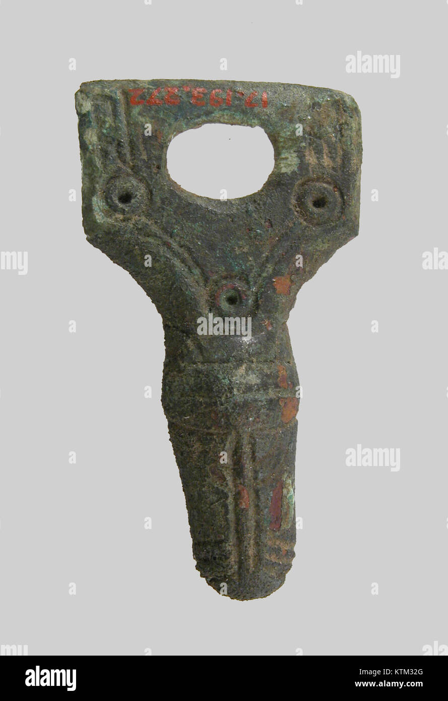 This belt ornament, cataloged at the Metropolitan Museum of Art (MET), showcases intricate craftsmanship typical of historical ornamental fashion. It is a notable example of decorative accessory design, often used in traditional attire. Stock Photo