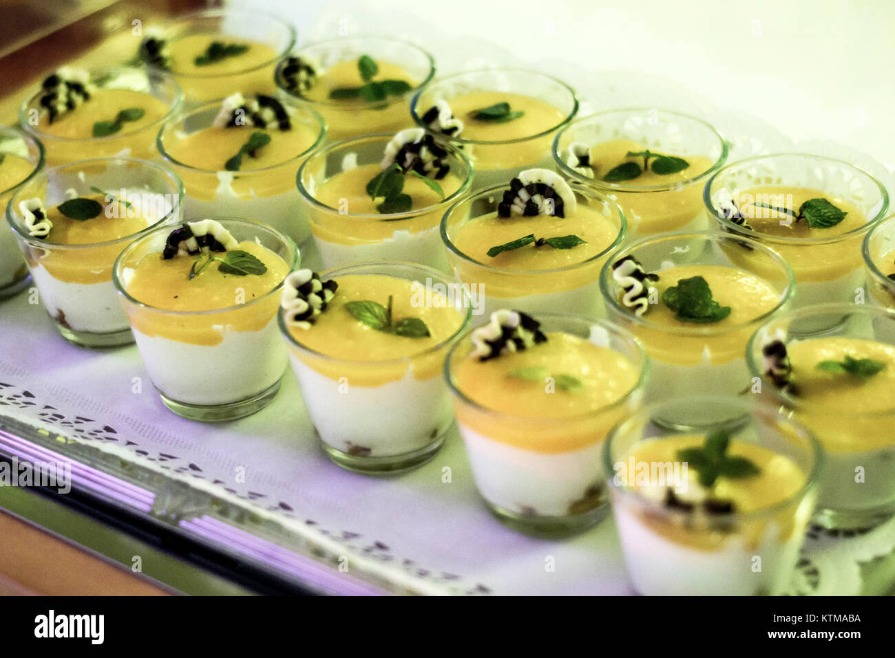 Closeup dessert on buffet table with fresh fruits and jelly and cream Stock Photo