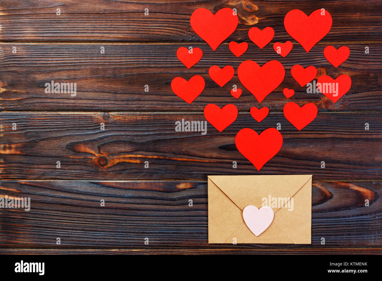 Valentine day love letter. Envelope from craft paper with red hearts ...