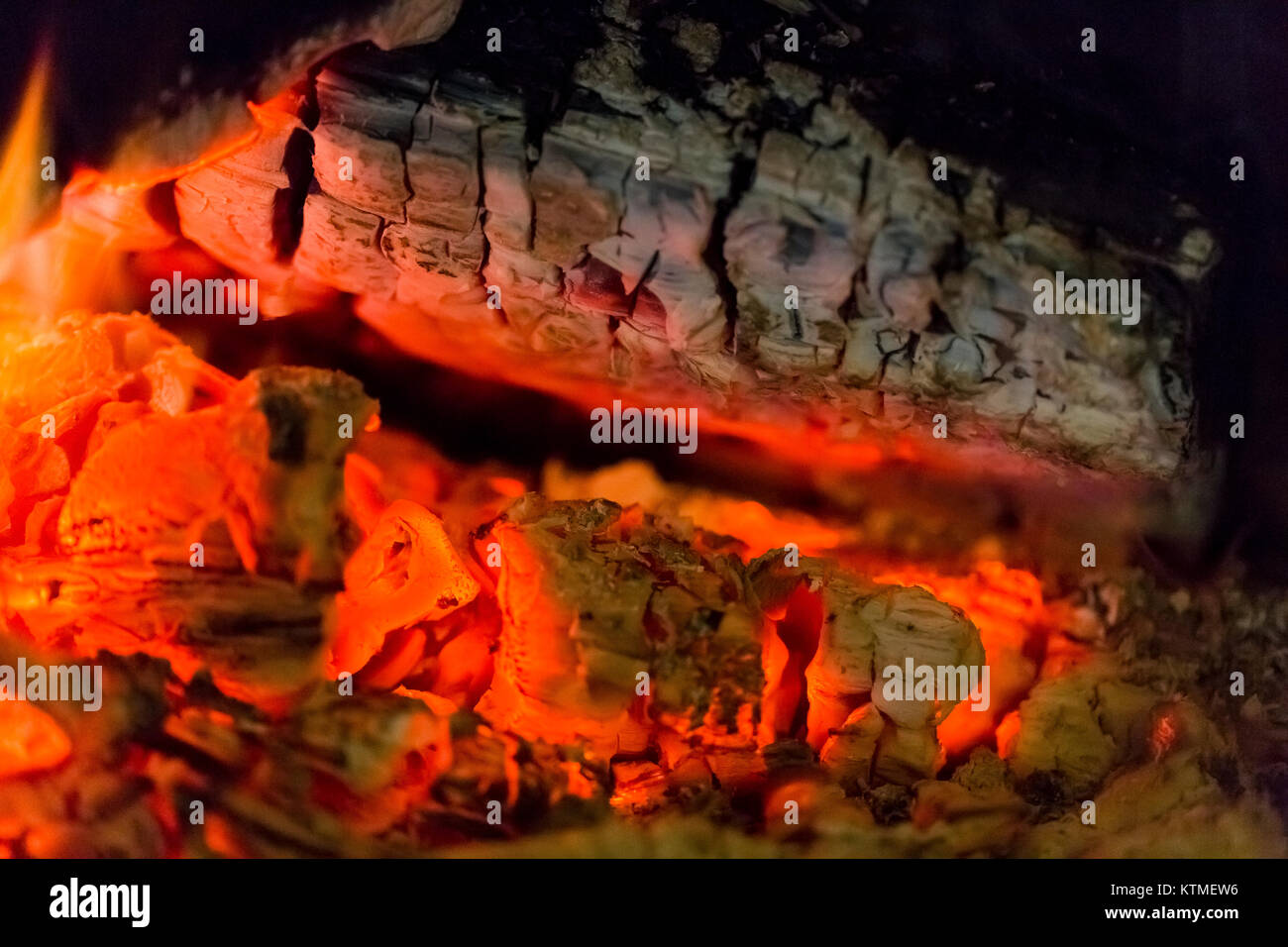 Fire fireplace ember wood home Embers closeup. Glowing embers in hot