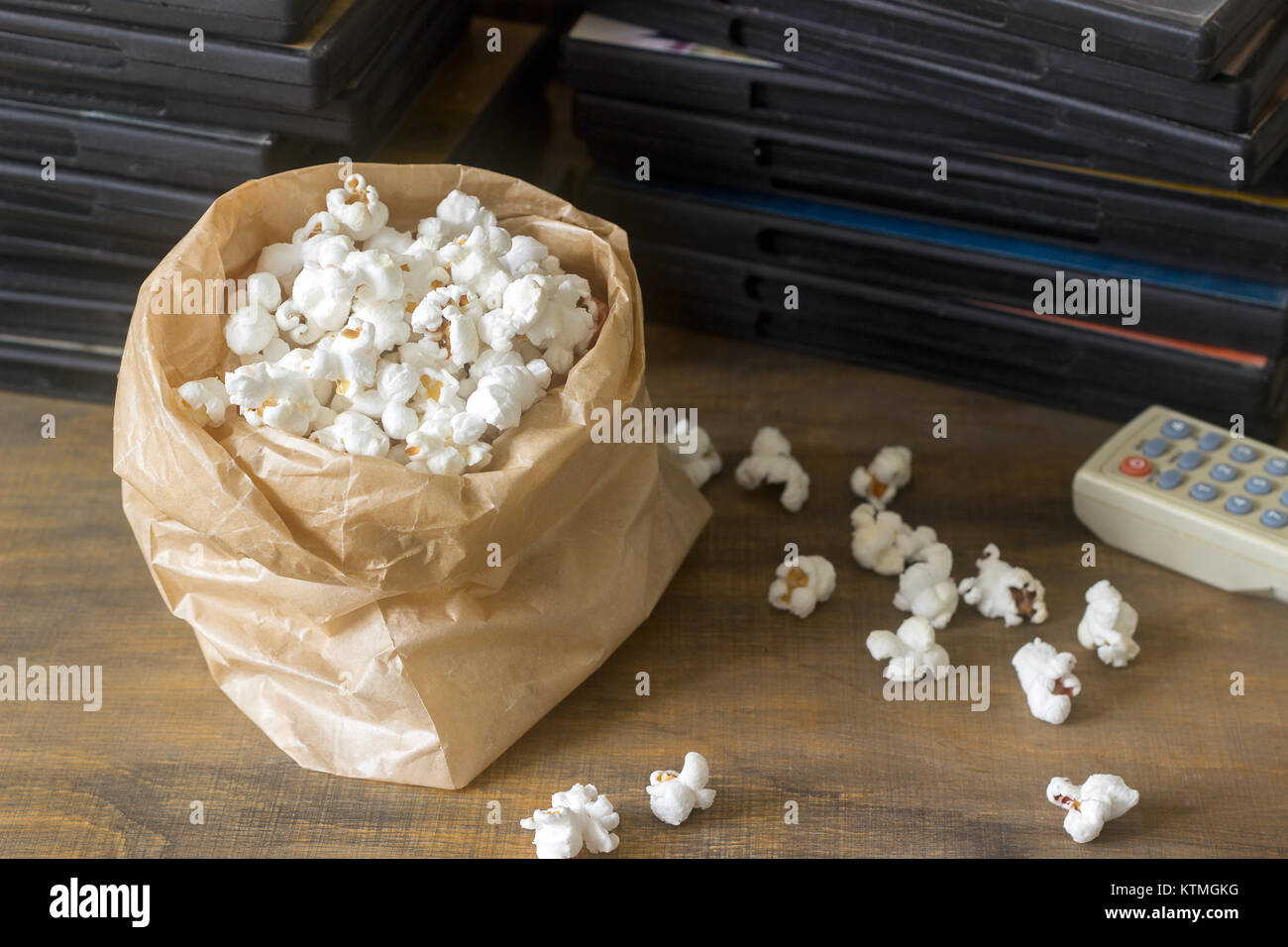 Pop corn and laser discs on a wooden surface. Rustic style, selective focus  Stock Photo - Alamy