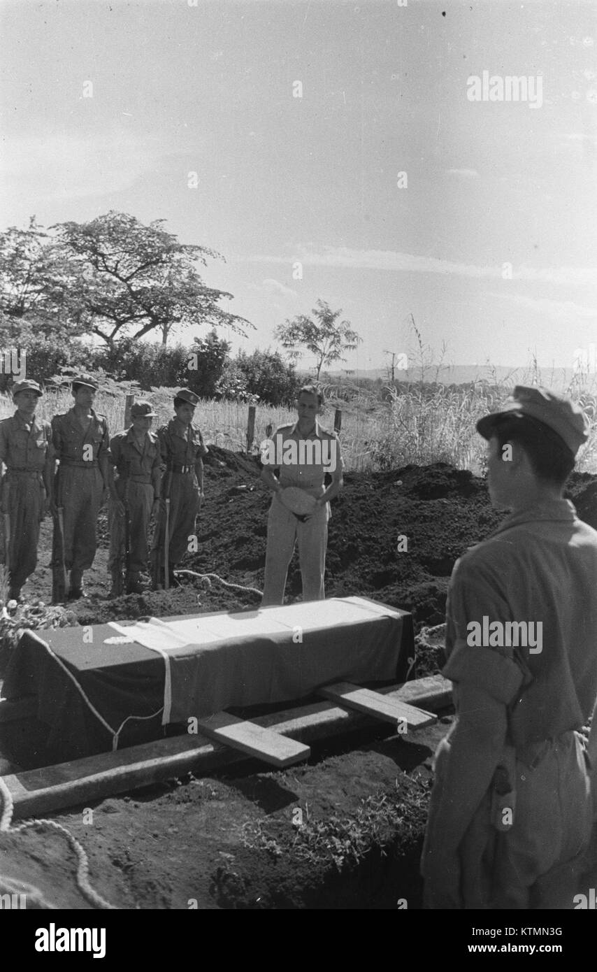 A funeral scene depicting an officer delivering a speech, capturing the ...