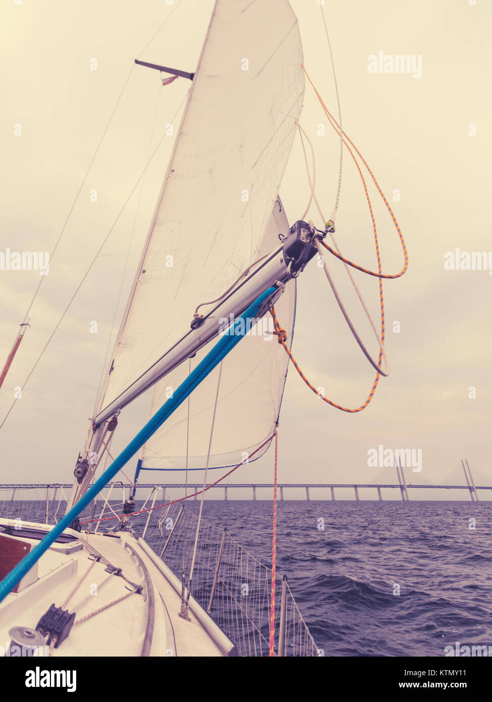 Oresundsbron. The Oresund bridge link between Denmark and Sweden, Europe, Baltic Sea. View from sailboat yacht. Overcast sky. Landmark and travel. Stock Photo