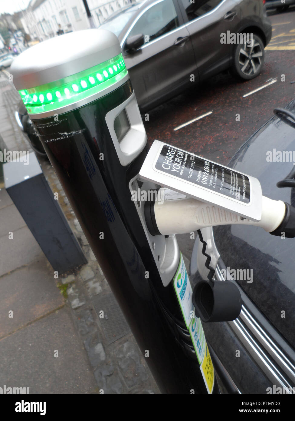 Electric car charger in use in Durham, England, UK Stock Photo Alamy