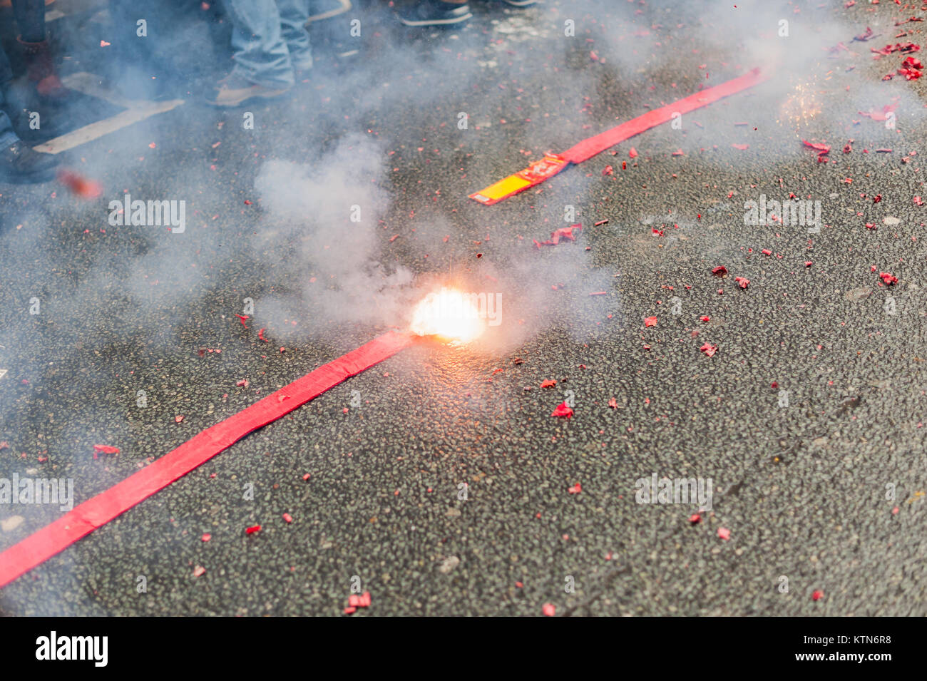 Firecrackers exploding in the street Stock Photo