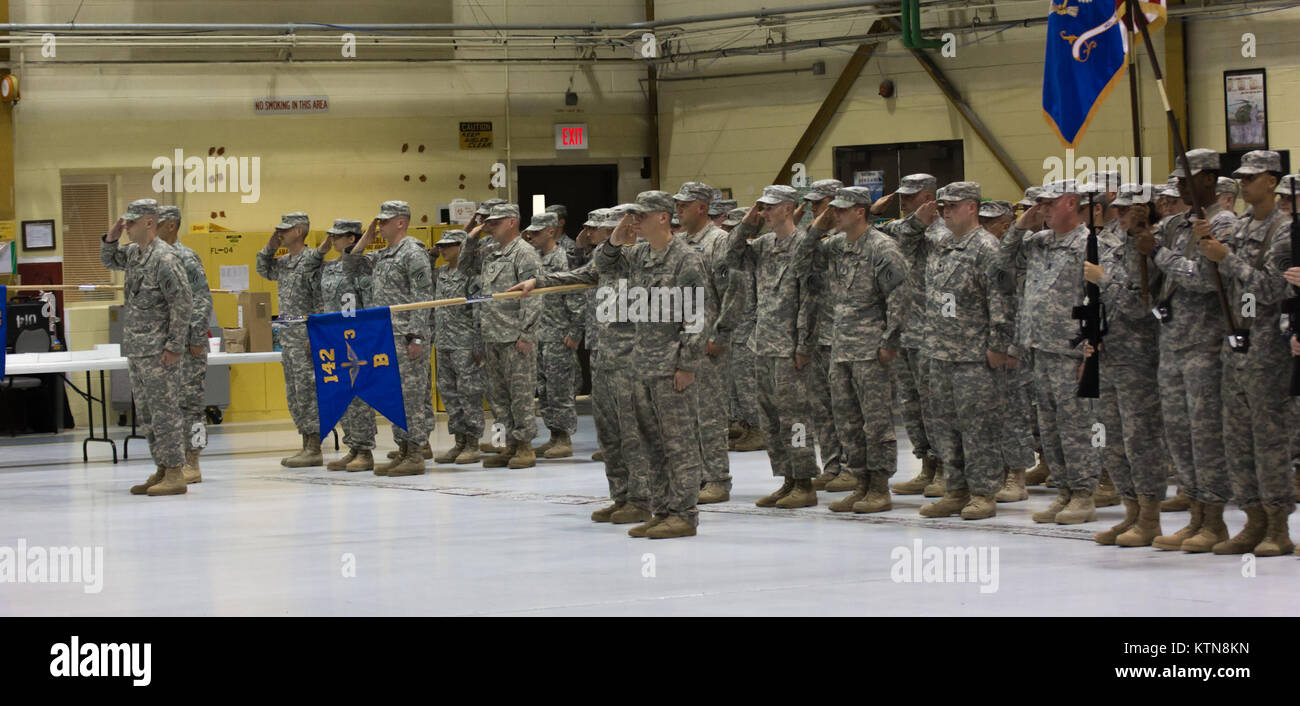 LATHAM, NY -- The soldiers of the 3-142nd Assault Helicopter Battalion salute their Commander during the Changing of Command of the Battalion from Lt. Col. Mark Slusar to Lt. Col. Jeffery Baker on 7 September, 2012. Stock Photo