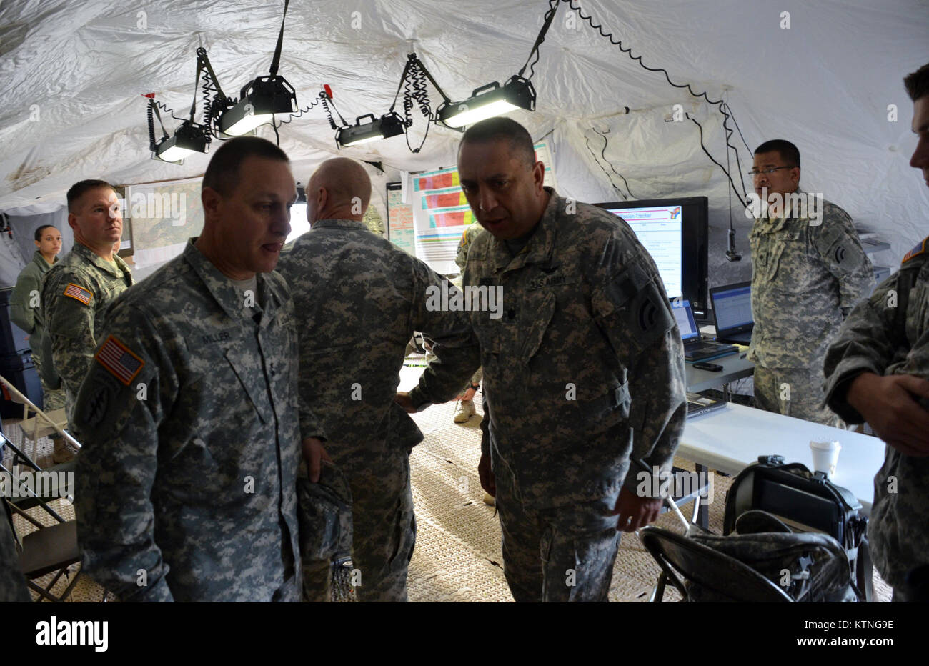 On Aug 18th 2013, Major General Harry E. Miller, Commanding General of the 42d Infantry Division, New York Army National Guard visited Soldiers of the 42nd CAB and 642 ASB during their Pre-Mobilization training being held at Fort Drum. MG Miller visited the soldiers at the various stations such as first aid, Commo, Land Nav and other Warrior Tasks as part of the PMT. MG Miller was also briefed by the Commander of the 3-142 Assault Helicopter Battalion, LTC Jeffrey Baker and his staff on current support operations the Battalion is providing during the PMT as well as future training operations Stock Photo