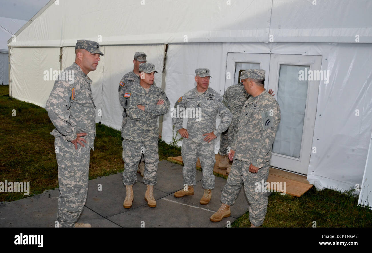 On Aug 18th 2013, Major General Harry E. Miller, Commanding General of the 42d Infantry Division, New York Army National Guard visited Soldiers of the 42nd CAB and 642 ASB during their Pre-Mobilization training being held at Fort Drum. MG Miller visited the soldiers at the various stations such as first aid, Commo, Land Nav and other Warrior Tasks as part of the PMT. MG Miller was also briefed by the Commander of the 3-142 Assault Helicopter Battalion, LTC Jeffrey Baker and his staff on current support operations the Battalion is providing during the PMT as well as future training operations Stock Photo