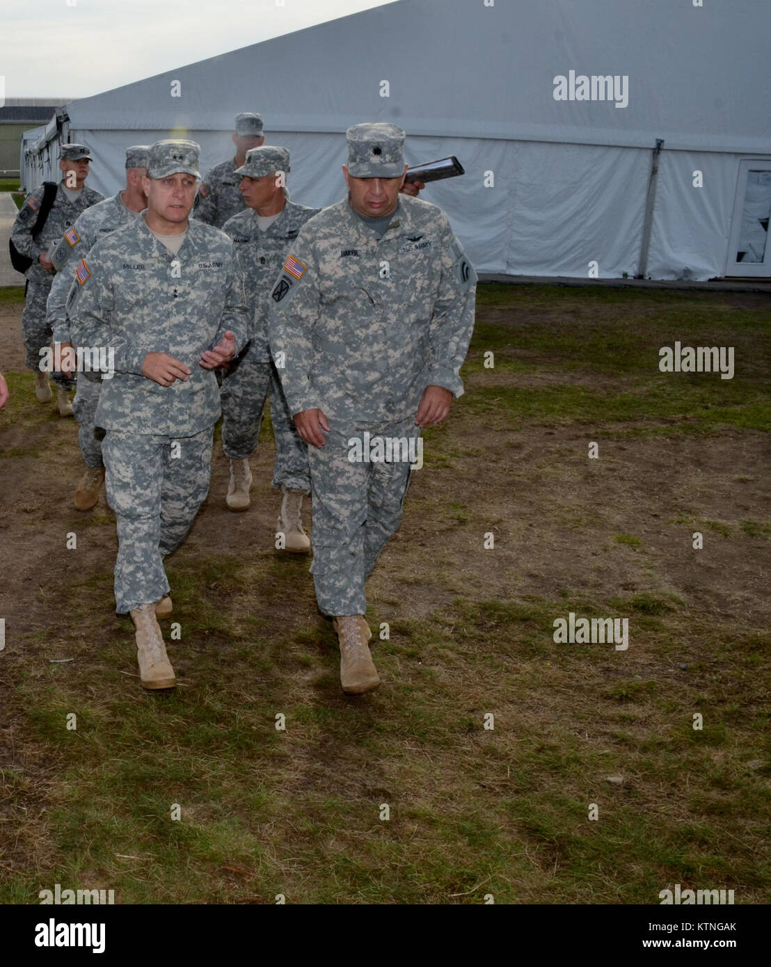 On Aug 18th 2013, Major General Harry E. Miller, Commanding General of the 42d Infantry Division, New York Army National Guard visited Soldiers of the 42nd CAB and 642 ASB during their Pre-Mobilization training being held at Fort Drum. MG Miller visited the soldiers at the various stations such as first aid, Commo, Land Nav and other Warrior Tasks as part of the PMT. MG Miller was also briefed by the Commander of the 3-142 Assault Helicopter Battalion, LTC Jeffrey Baker and his staff on current support operations the Battalion is providing during the PMT as well as future training operations Stock Photo