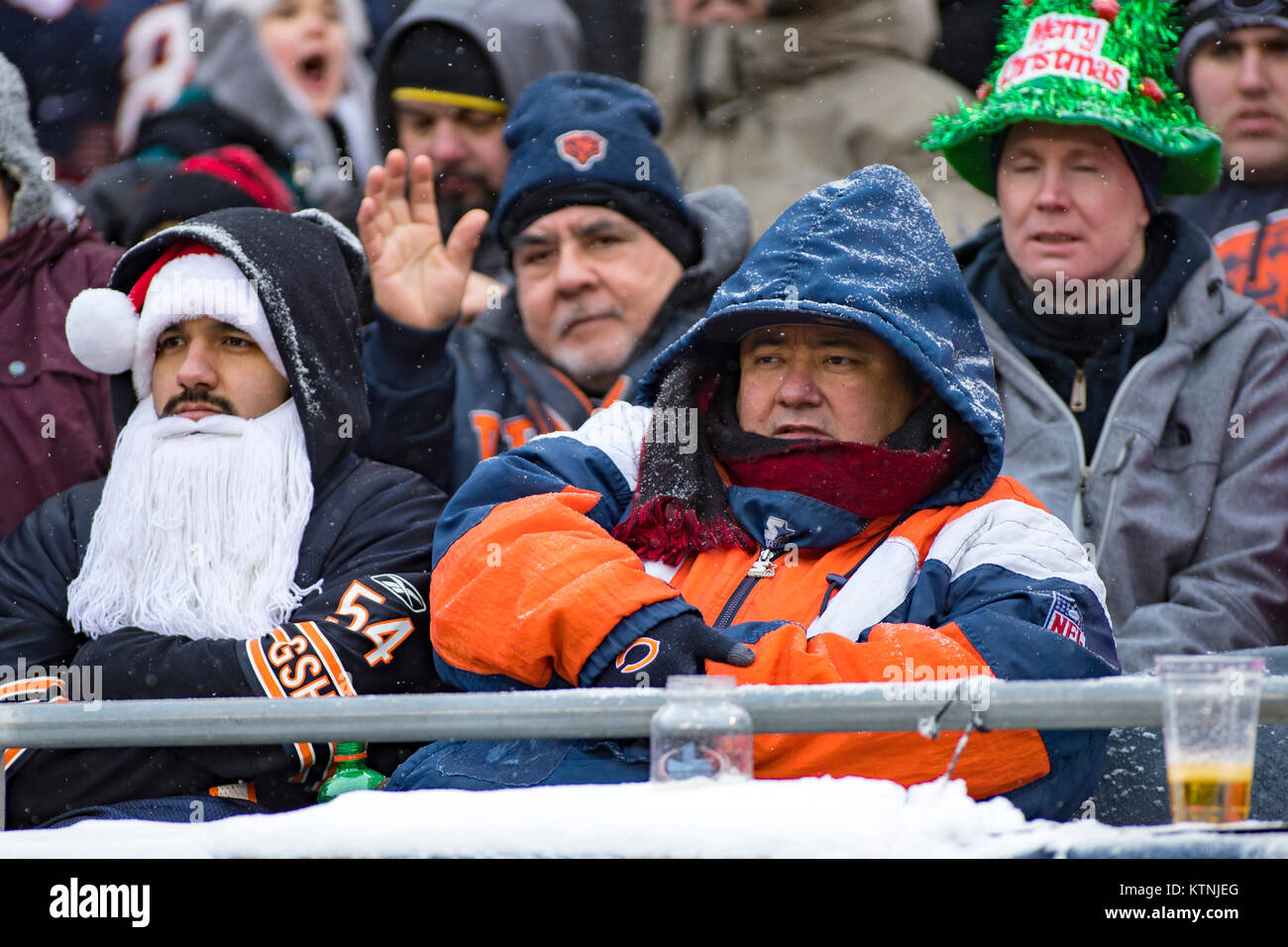 Chicago, Illinois, USA. 24th Dec, 2017. - Bears fans takes part in the  Christmas Eve spirit as they watch the NFL Game between the Cleveland  Browns and Chicago Bears at Soldier Field
