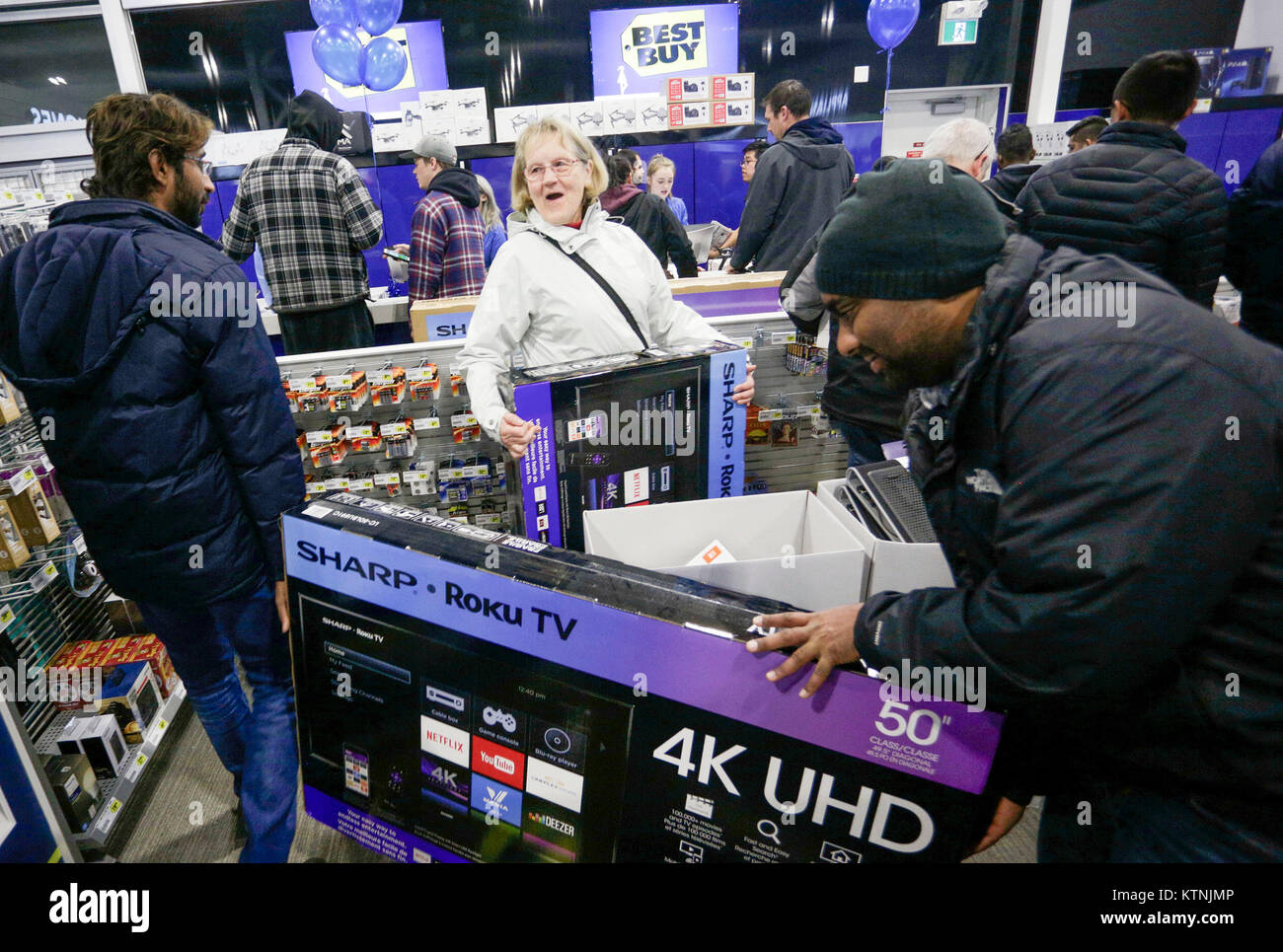 Vancouver. 26th Dec, 2017. Shoppers purchase large screen televisions