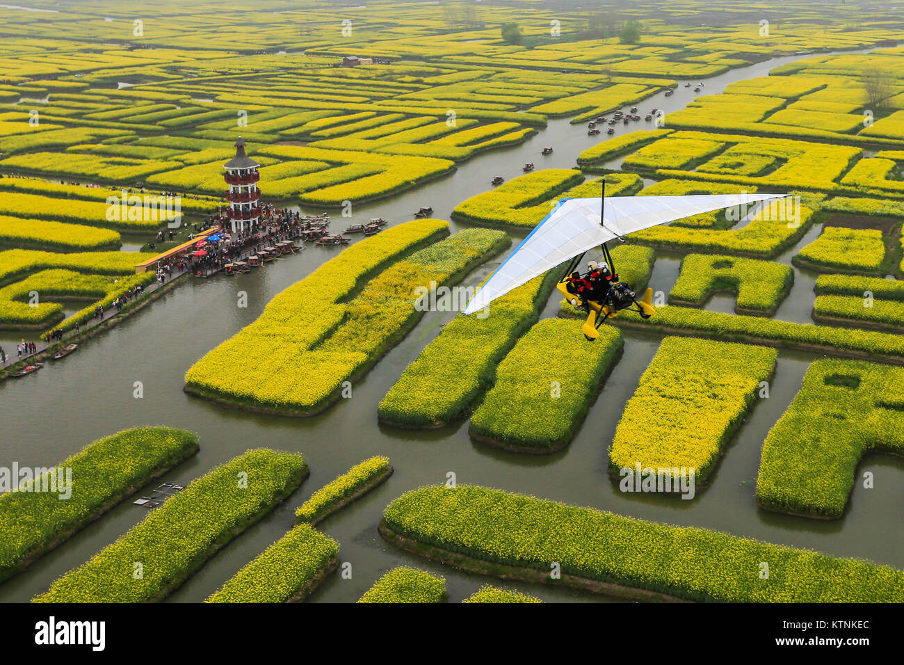 Xinghua, China's Jiangsu Province. 9th Apr, 2017. Tourists visit scenic spot at Ganggu Township of Xinghua City, east China's Jiangsu Province, April 9, 2017. Rural tourism has seen robust growth in China in past years as more city-dwellers love a taste of the country life. Credit: Zhou Haijun/Xinhua/Alamy Live News Stock Photo