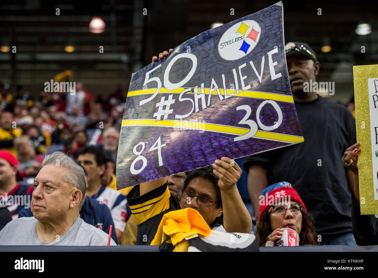Houston, TX, USA. 25th Dec, 2017. A Pittsburgh Steelers fan holds up a Shalieve sign for injured linebacker Ryan Shazier (50) prior to an NFL football game between the Houston Texans and the Pittsburgh Steelers at NRG Stadium in Houston, TX. The Steelers won the game 34 to 6.Trask Smith/CSM/Alamy Live News Stock Photo