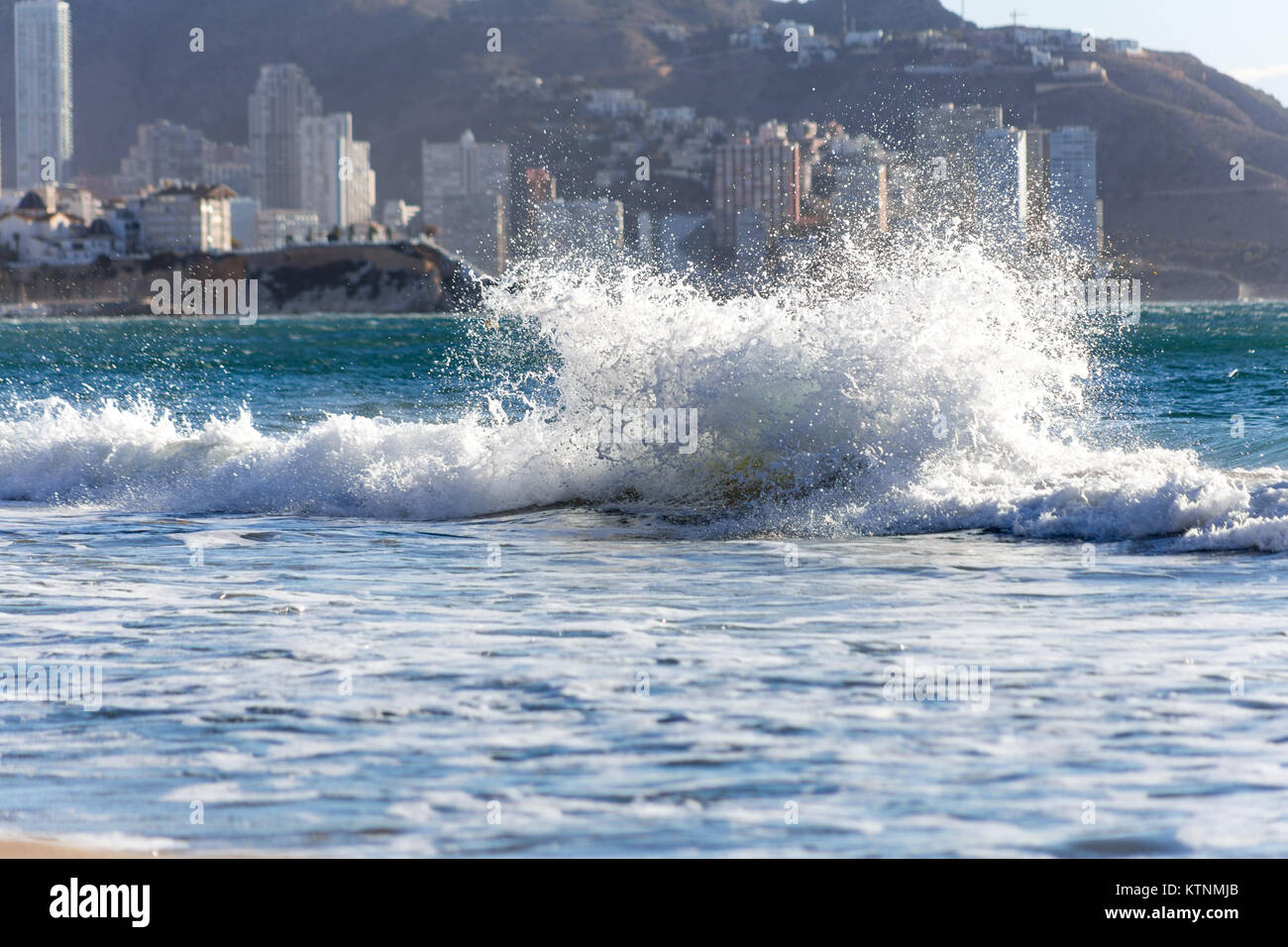 Benidorm, Costa Blanca, Spain, 27th December 2017. Storm Bruno sweeps across Spain and out to sea along the Costa Blanca coast. The crests of waves are whipped up and blown backwards as the wind blows. Credit: Mick Flynn/Alamy Live News Stock Photo