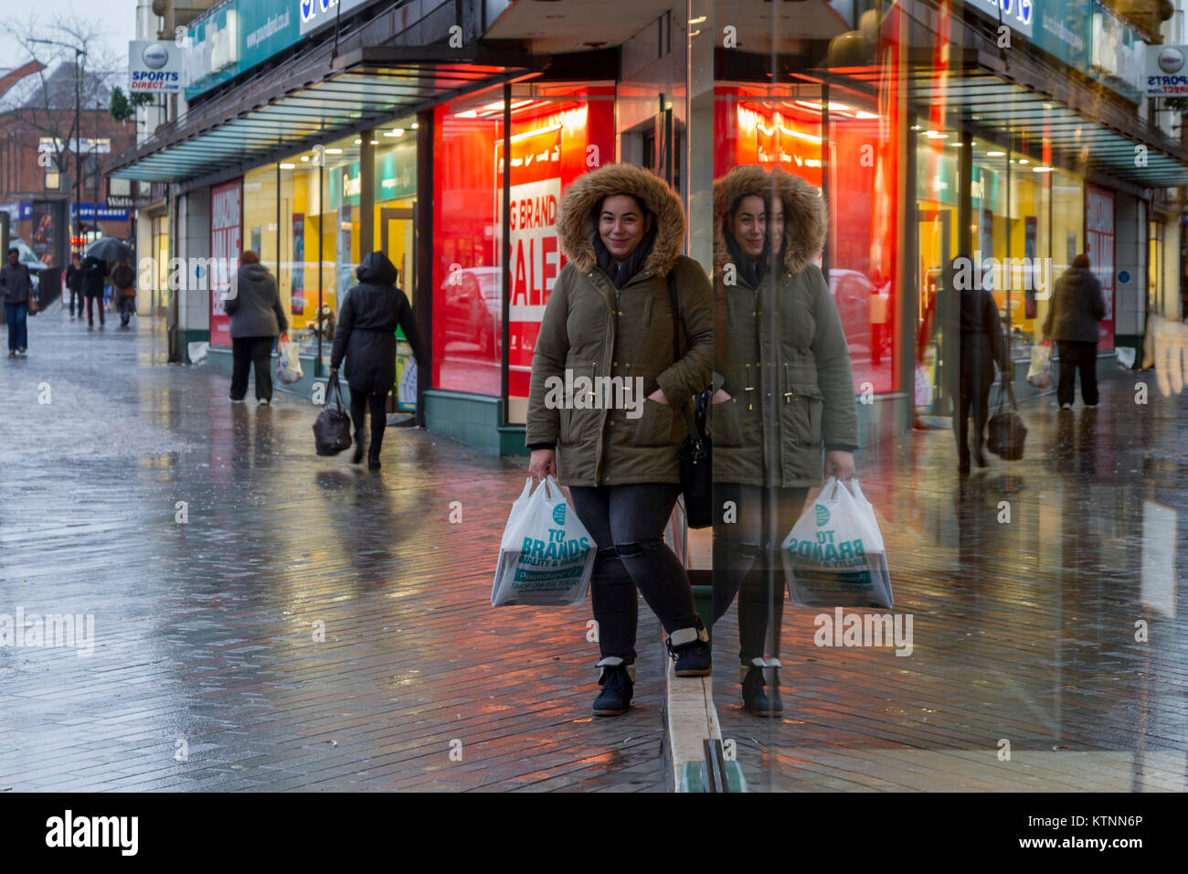 Northampton, Weather, U.K. 27th December 2017. Heavy overnight rain with snow tuning to sleet this morning giving a very wet and cold start to the day, Abington st in the town centre is very quite this morning with very few shoppers braving the nasty conditions.  Credit: Keith J Smith./Alamy Live News Stock Photo