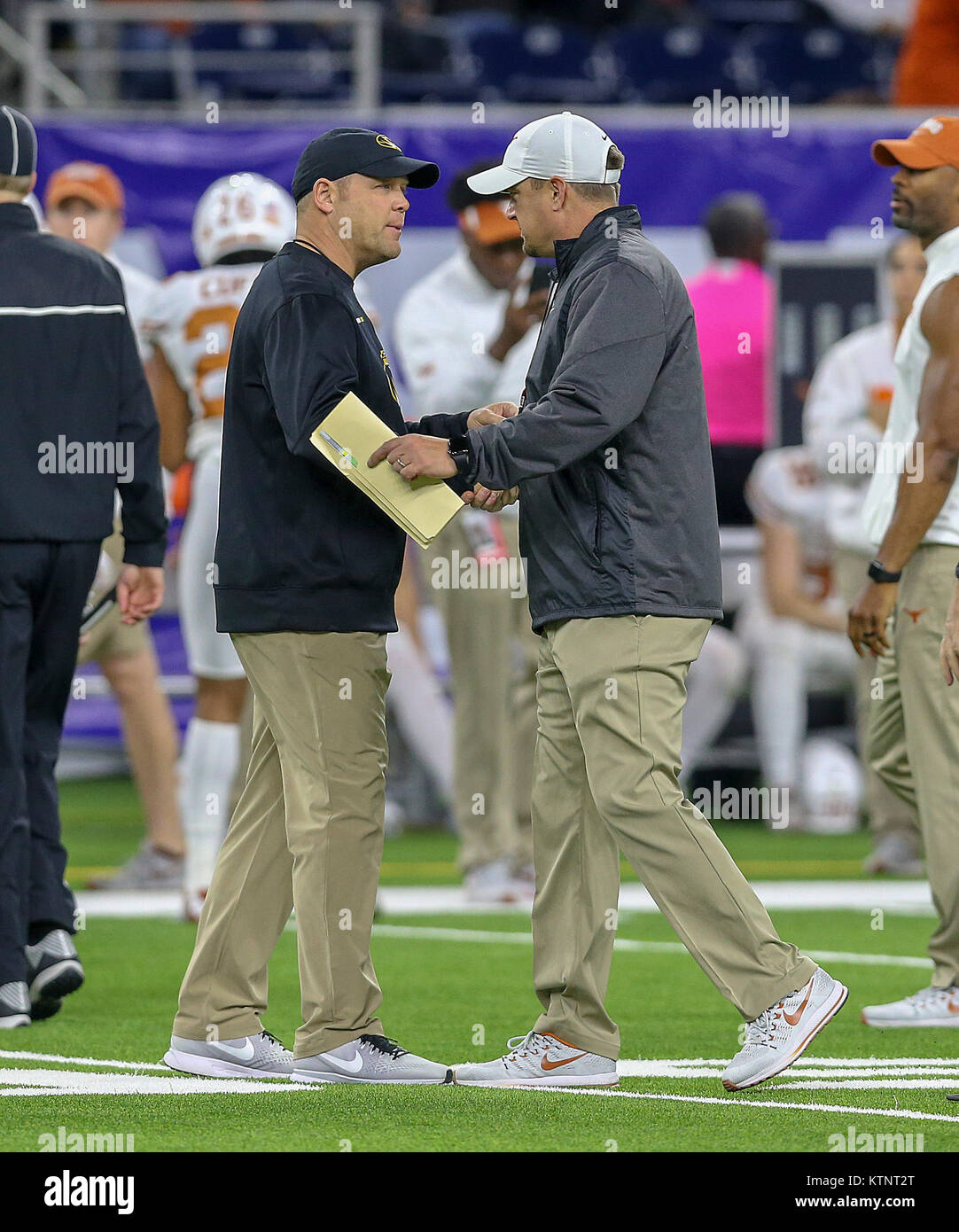 Houston, TX, USA. 27th Dec, 2017. Missouri Tigers head coach Barry Odom and Texas Longhorns head