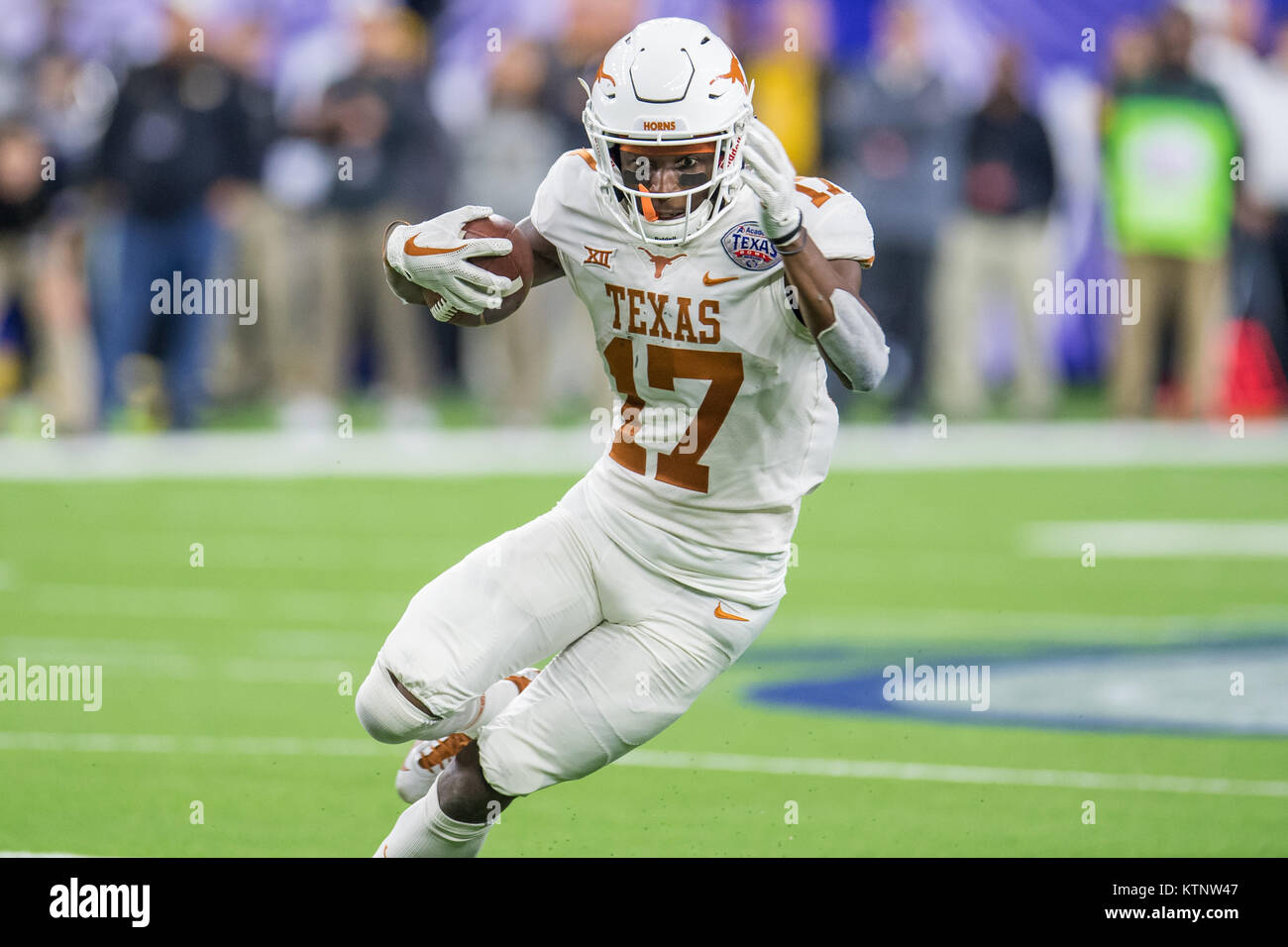 Houston, TX, USA. 27th Dec, 2017. Texas Longhorns wide receiver Reggie Hemphill-Mapps (17) runs with the ball during the 4th quarter of the Texas Bowl NCAA football game between the Texas Longhorns and the Missouri Tigers at NRG Stadium in Houston, TX. Texas won the game 33 to 16.Trask Smith/CSM/Alamy Live News Stock Photo
