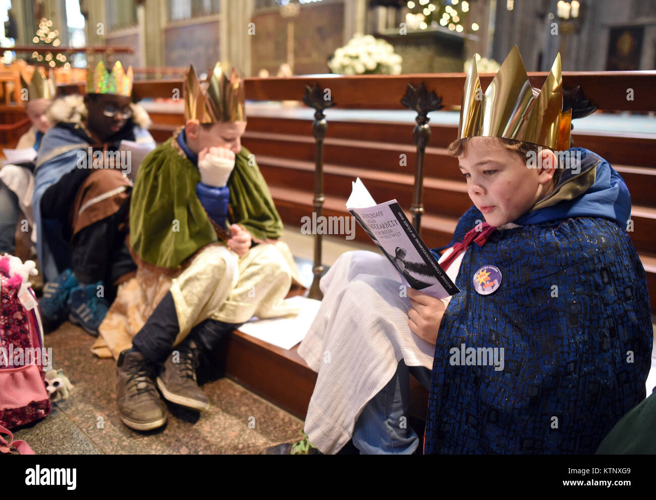 Carol singers sit during their valedictory service in the Cologne
