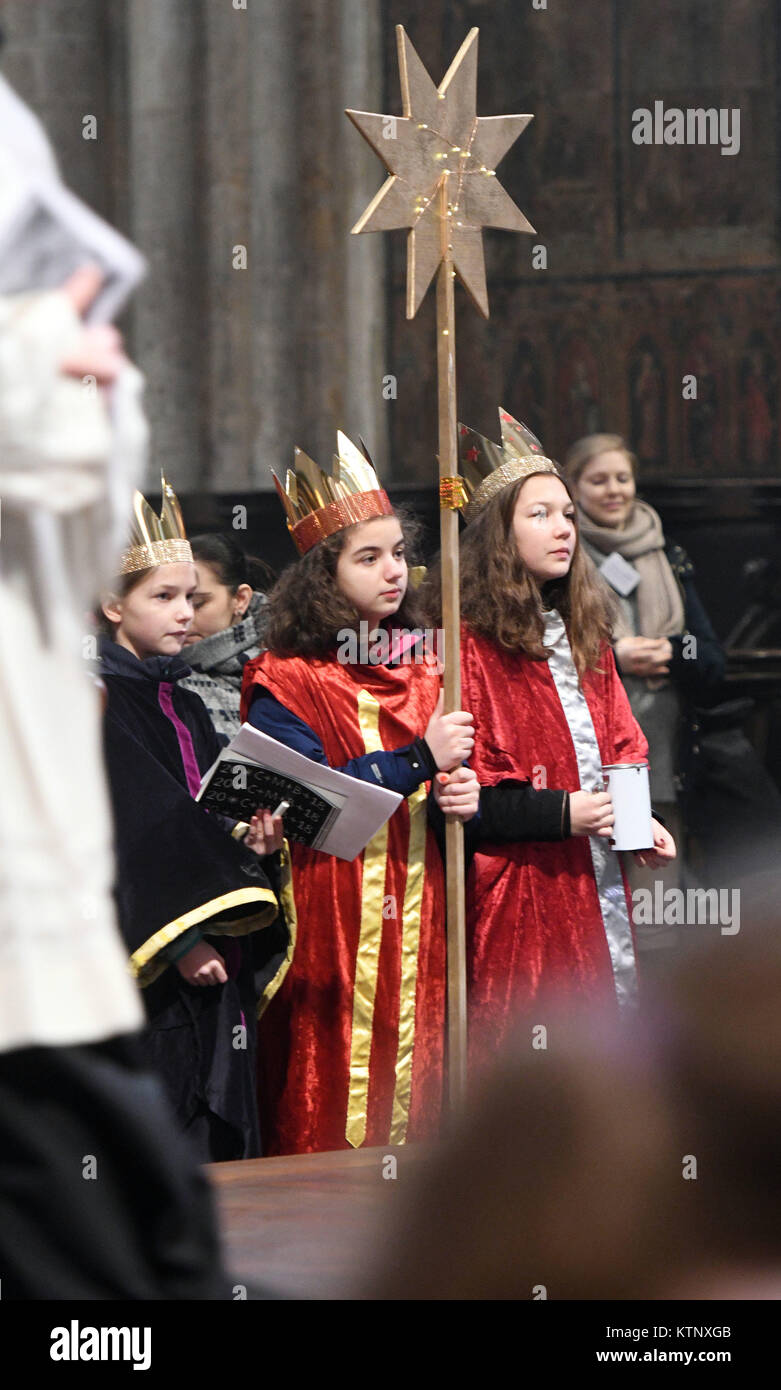 Carol singers stand during their valedictory service in the Cologne