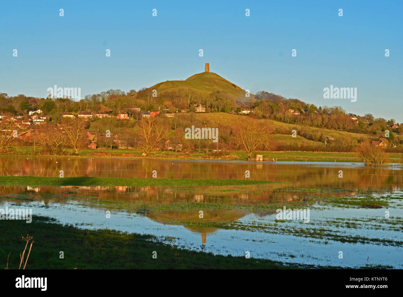 Glastonbury, UK. 28th Dec, 2017. UK Weather Glastonbury Tor seen with its reflection in flood water. Credit: Robert Timoney/Alamy Live News Stock Photo