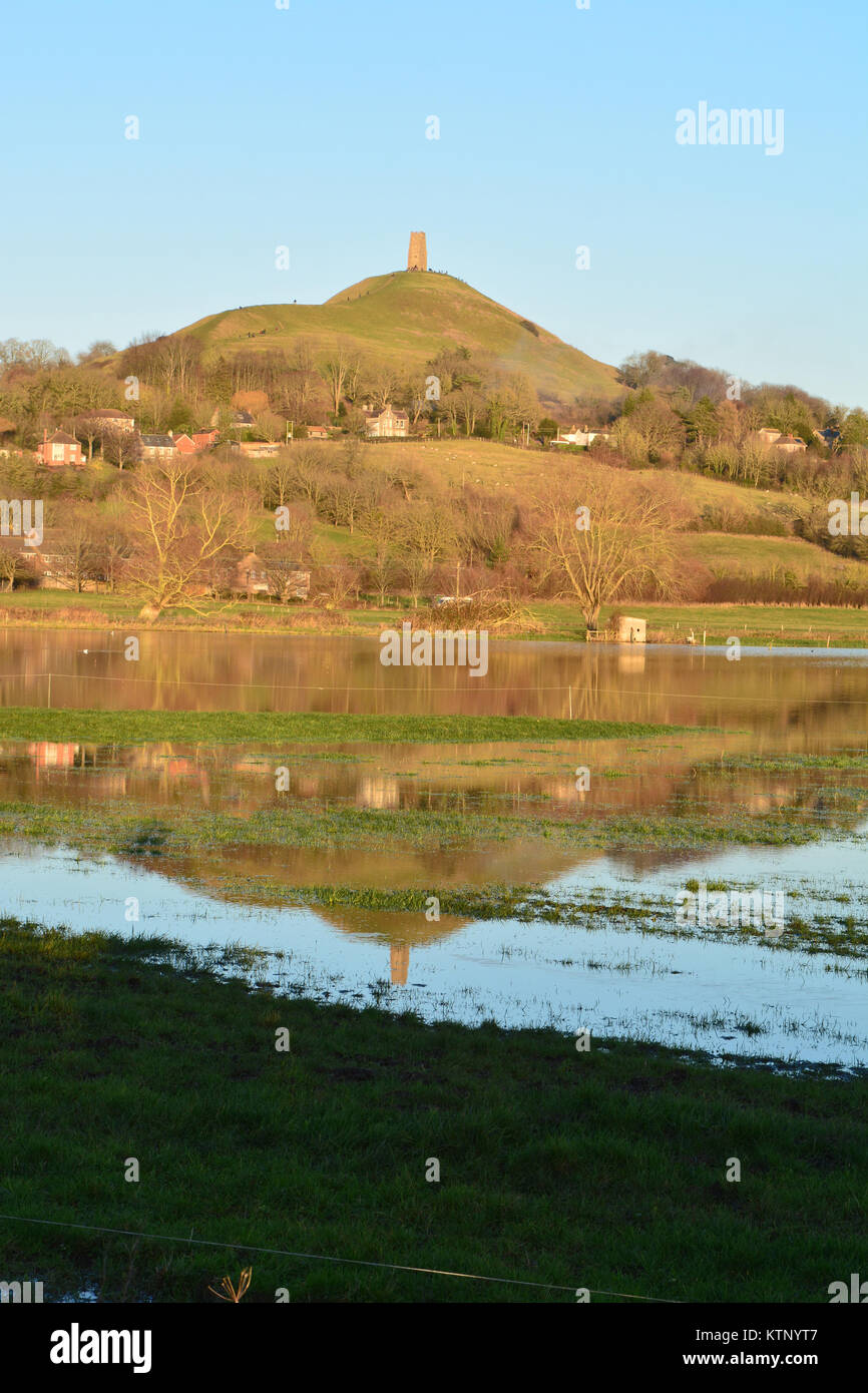 Glastonbury, UK. 28th Dec, 2017. UK Weather Glastonbury Tor seen with its reflection in flood water. Credit: Robert Timoney/Alamy Live News Stock Photo