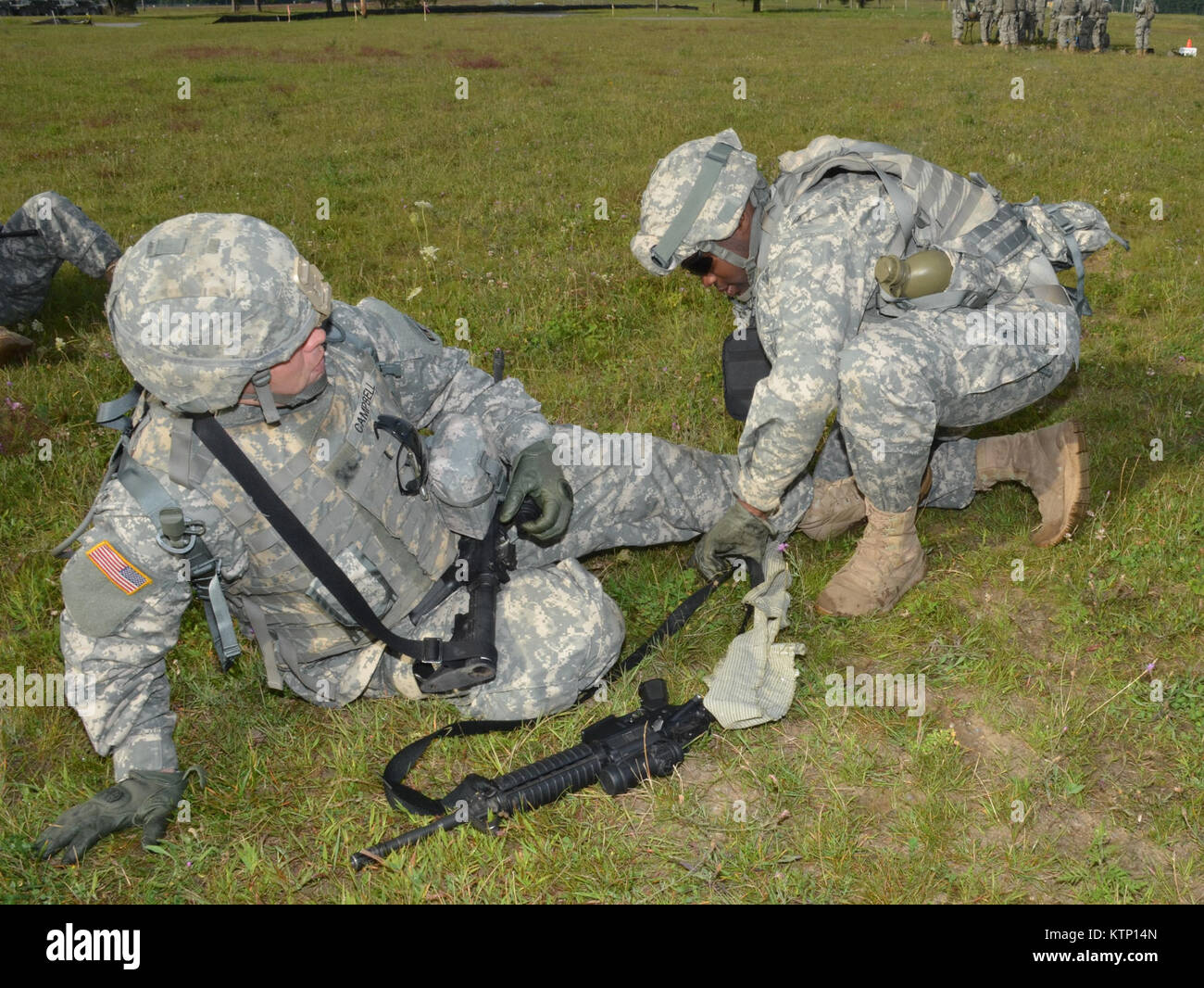 On Aug 18th 2013, Major General Harry E. Miller, Commanding General of the 42d Infantry Division, New York Army National Guard visited Soldiers of the 42nd CAB and 642 ASB during their Pre-Mobilization training being held at Fort Drum. MG Miller visited the soldiers at the various stations such as first aid, Commo, Land Nav and other Warrior Tasks as part of the PMT. MG Miller was also briefed by the Commander of the 3-142 Assault Helicopter Battalion, LTC Jeffrey Baker and his staff on current support operations the Battalion is providing during the PMT as well as future training operations Stock Photo