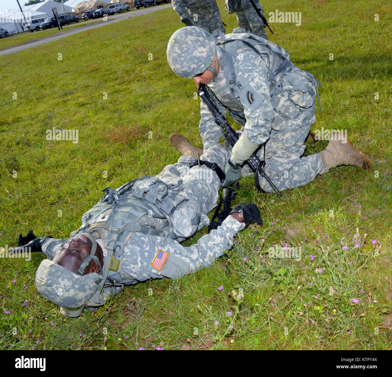 On Aug 18th 2013, Major General Harry E. Miller, Commanding General of the 42d Infantry Division, New York Army National Guard visited Soldiers of the 42nd CAB and 642 ASB during their Pre-Mobilization training being held at Fort Drum. MG Miller visited the soldiers at the various stations such as first aid, Commo, Land Nav and other Warrior Tasks as part of the PMT. MG Miller was also briefed by the Commander of the 3-142 Assault Helicopter Battalion, LTC Jeffrey Baker and his staff on current support operations the Battalion is providing during the PMT as well as future training operations Stock Photo
