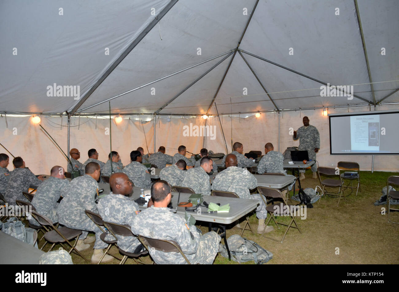 On Aug 18th 2013, Major General Harry E. Miller, Commanding General of the 42d Infantry Division, New York Army National Guard visited Soldiers of the 42nd CAB and 642 ASB during their Pre-Mobilization training being held at Fort Drum. MG Miller visited the soldiers at the various stations such as first aid, Commo, Land Nav and other Warrior Tasks as part of the PMT. MG Miller was also briefed by the Commander of the 3-142 Assault Helicopter Battalion, LTC Jeffrey Baker and his staff on current support operations the Battalion is providing during the PMT as well as future training operations Stock Photo