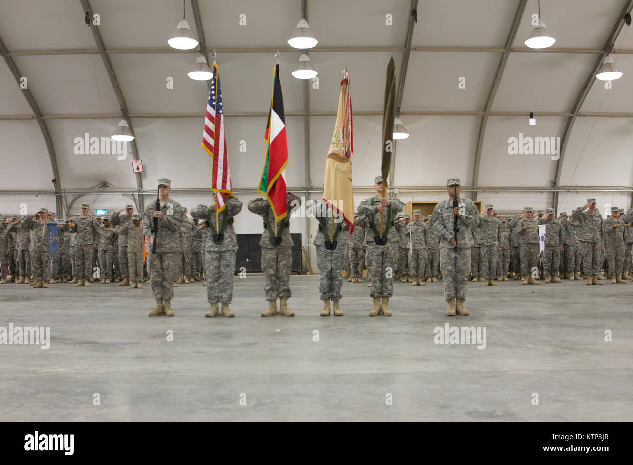 The  642nd  Aviation Support Battalion, New York Army National Guard, assumes command of its role in Camp Buehring, Kuwait from the 449th GSAB, Texas Army National Guard, on Dec. 14th, 2013.  The 642nd ASB arrived in Kuwait last week as part of the 42nd Combat Aviation Brigade, which will be running army aviation operations for the region.  (U.S. Army photo by Spc. Harley Jelis/Released) Stock Photo