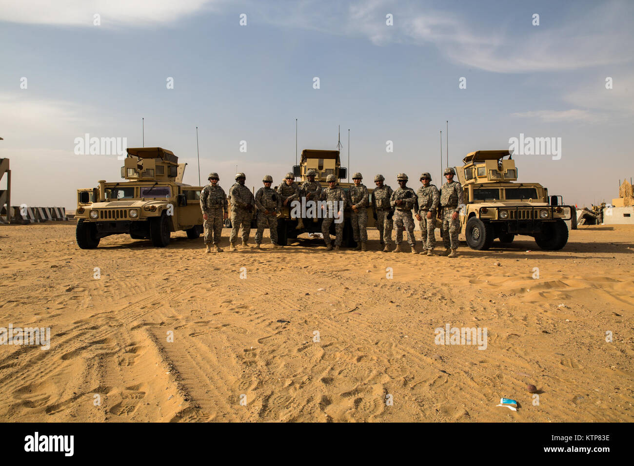 Soldiers from HHC 42nd Combat Aviation Brigade stand for a group photo ...
