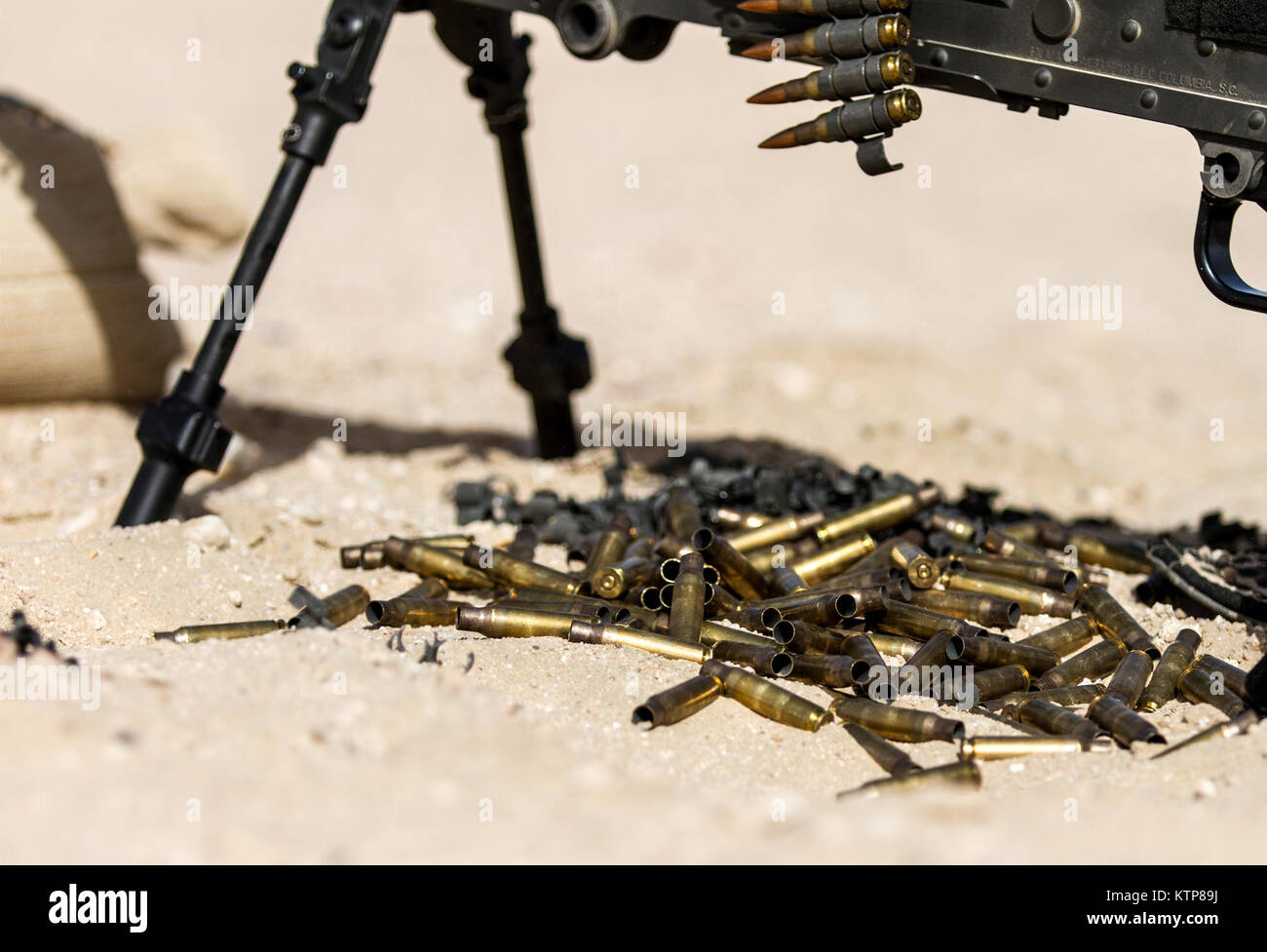 Soldiers from 3rd Battalion, 238th General Support Aviation Battalion (GSAB), and 3rd Battalion, 142nd Assault Helicopter Battalion (AHB), shoot the first phase of aerial gunnery with a 240B machine gun on June 3, 2014, near Camp Buehring, Kuwait.  Once refreshed with the weapon system on the ground the aviators of the battalions will conduct aerial gunnery training and qualifications with their UH-60 Black Hawks later on in the month.  The GSAB and AHB, from the Michigan and New York Army National Guards, respectively, are both deployed to Kuwait under the 42nd Combat Aviation Brigade in supp Stock Photo