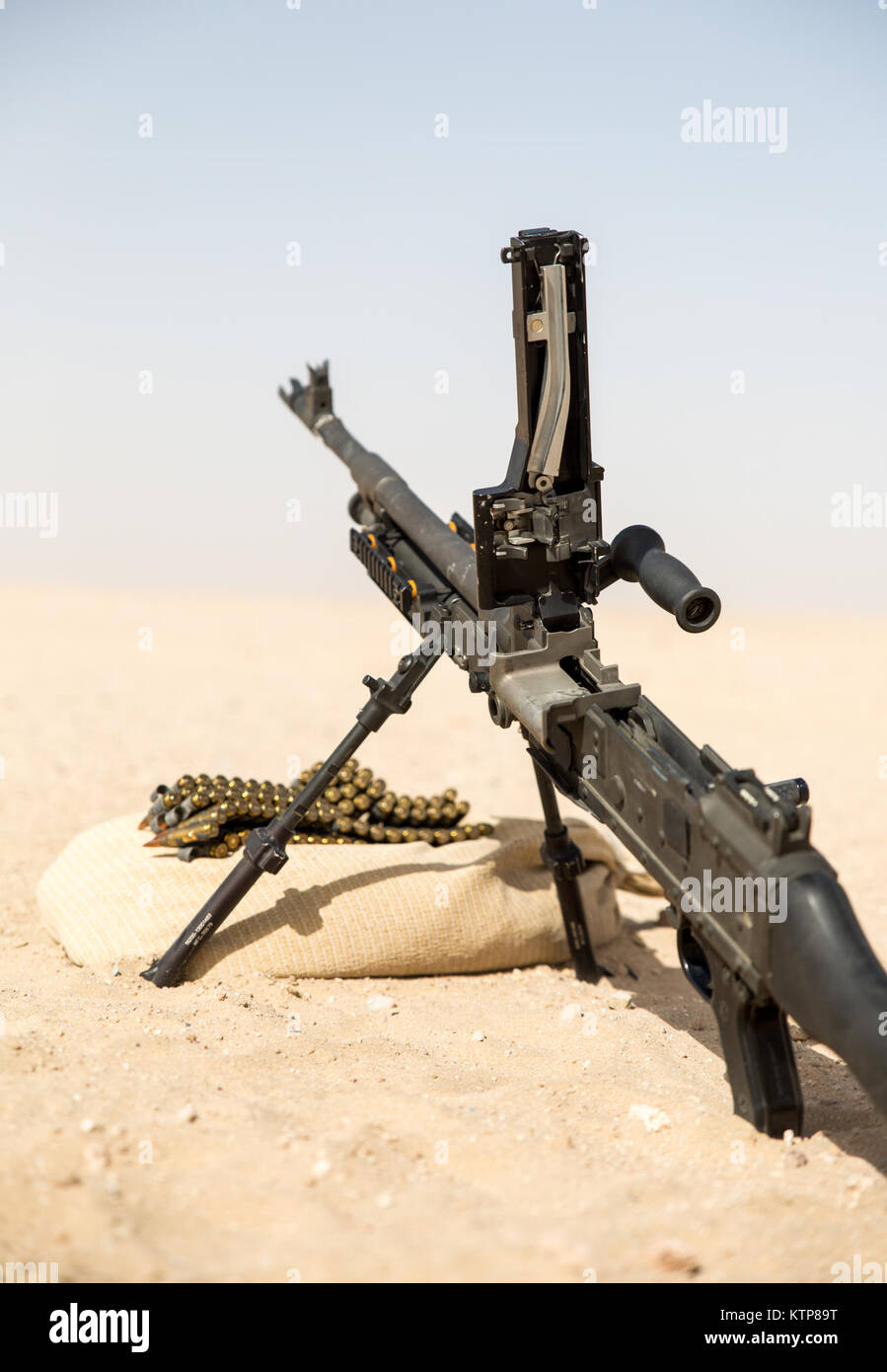 A 240B machine gun sits ready to fire for soldiers from 3rd Battalion, 238th General Support Aviation Battalion (GSAB), and 3rd Battalion, 142nd Assault Helicopter Battalion (AHB), to shoot the first phase of aerial gunnery on June 3, 2014, near Camp Buehring, Kuwait.  Once refreshed with the weapon system on the ground the aviators of the battalions will conduct aerial gunnery training and qualifications with their UH-60 Black Hawks later on in the month.  The GSAB and AHB, from the Michigan and New York Army National Guards, respectively, are both deployed to Kuwait under the 42nd Combat Avi Stock Photo