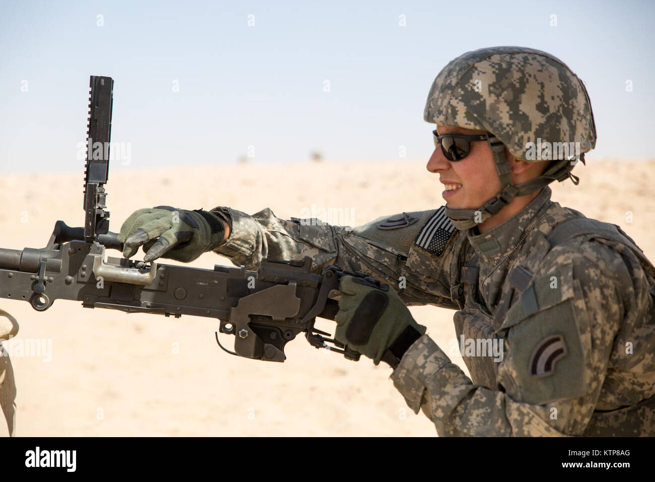 Soldiers from 3rd Battalion, 238th General Support Aviation Battalion (GSAB), and 3rd Battalion, 142nd Assault Helicopter Battalion (AHB), shoot the first phase of aerial gunnery with a 240B machine gun on June 3, 2014, near Camp Buehring, Kuwait.  Once refreshed with the weapon system on the ground the aviators of the battalions will conduct aerial gunnery training and qualifications with their UH-60 Black Hawks later on in the month.  The GSAB and AHB, from the Michigan and New York Army National Guards, respectively, are both deployed to Kuwait under the 42nd Combat Aviation Brigade in supp Stock Photo