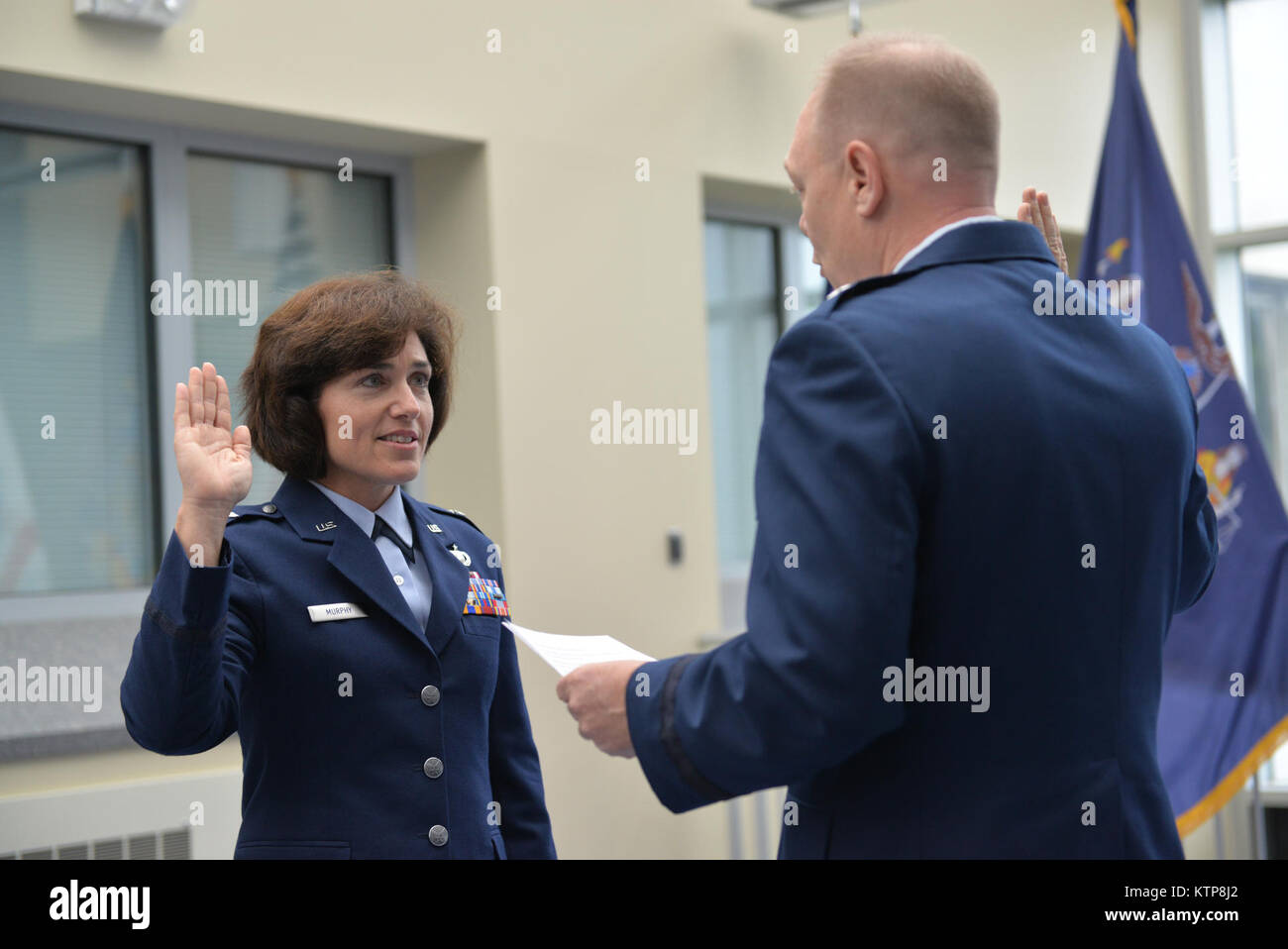 LATHAM- Brig Gen. Kevin Bradley administers the oath of office to Col. Maureen Murphy, director of staff for the New York Air National Guard during promotion ceremonies at New York National Guard headquarters on Friday, June 13. Stock Photo