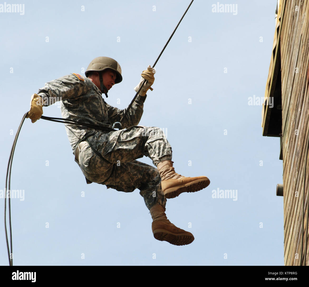 A soldier rappels from the training tower at Camp Smith, NY during