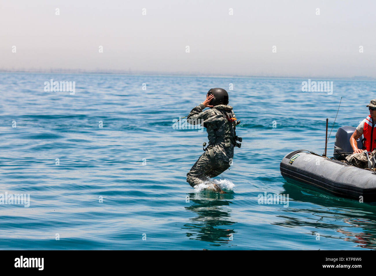Soldiers of the 42nd Combat Aviation Brigade (CAB) work with Army ...