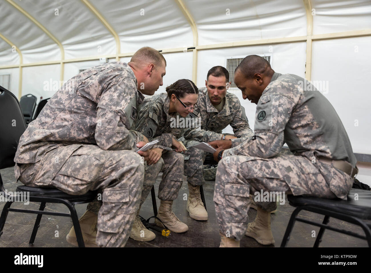 Sgt. McLaughlin (center), a geospatial engineer with HHC, 42nd