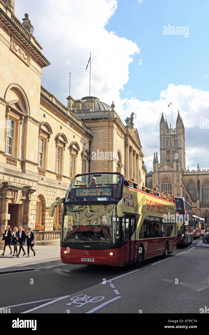 Double deck tourist bus, with Bath Abbey in background, Bath Stock Photo
