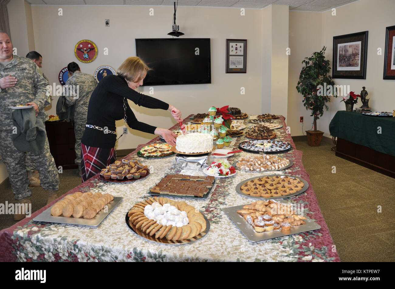 DMNA employees enjoy a holiday gathering hosted by the Office of the Adjutant General, Dec. 19. Stock Photo