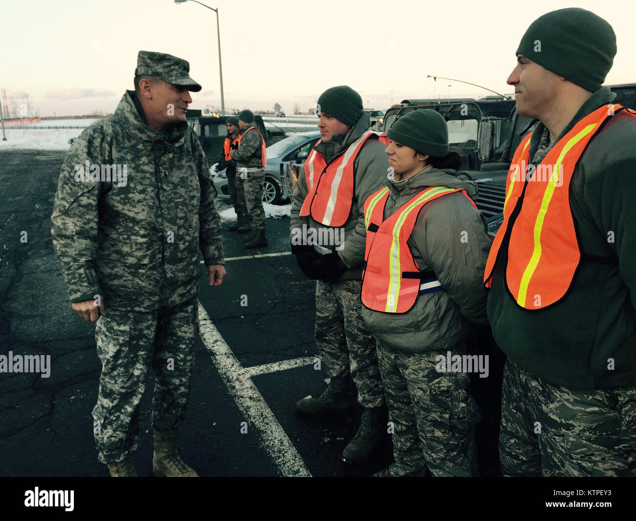 Major General Patrick Murphy, the Adjutant General of New York speaks to Army National Guard Soldiers preparing to go on a traffic control point mission on Friday, Jan. 9, 2015 as the New York National Guard assisted the New York State Thruway Authority in closing portions of the road in Buffalo due to poor weather conditions. (U.S. Army National Guard photo by Major Mark Frank/Released) Stock Photo