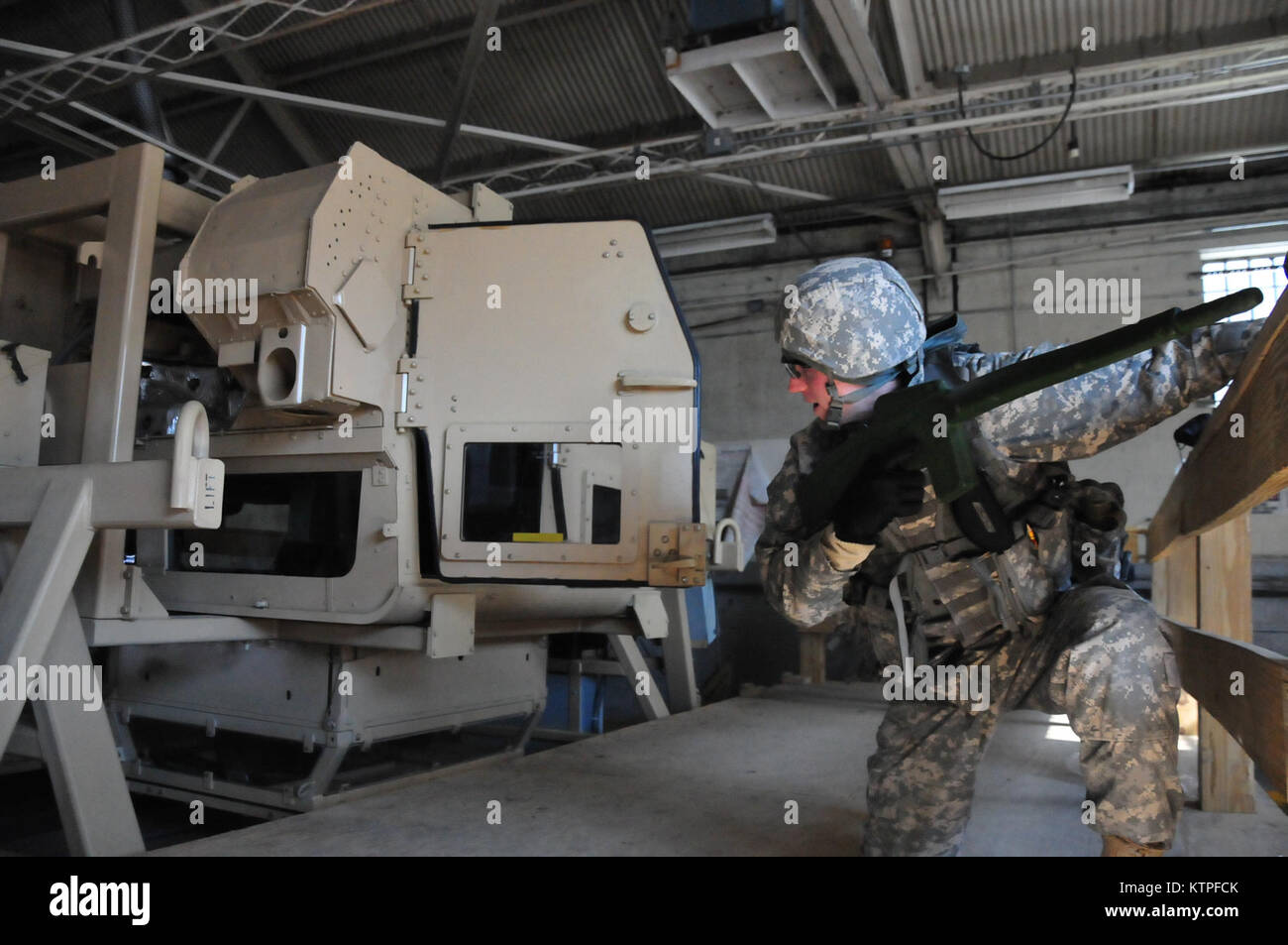 A 42nd Infantry Division Soldier emerges from the Humvee rollover training  simulator on Feb. 25 at Camp Smith Training Site before as a group of 42nd Soldiers certify on the simulator as part of their pre-mobilization training before deploying to Guantanamo Bay, Cuba. Photo by Sgt. 1st class Steven Petibone, 42nd Infantry Division. Stock Photo