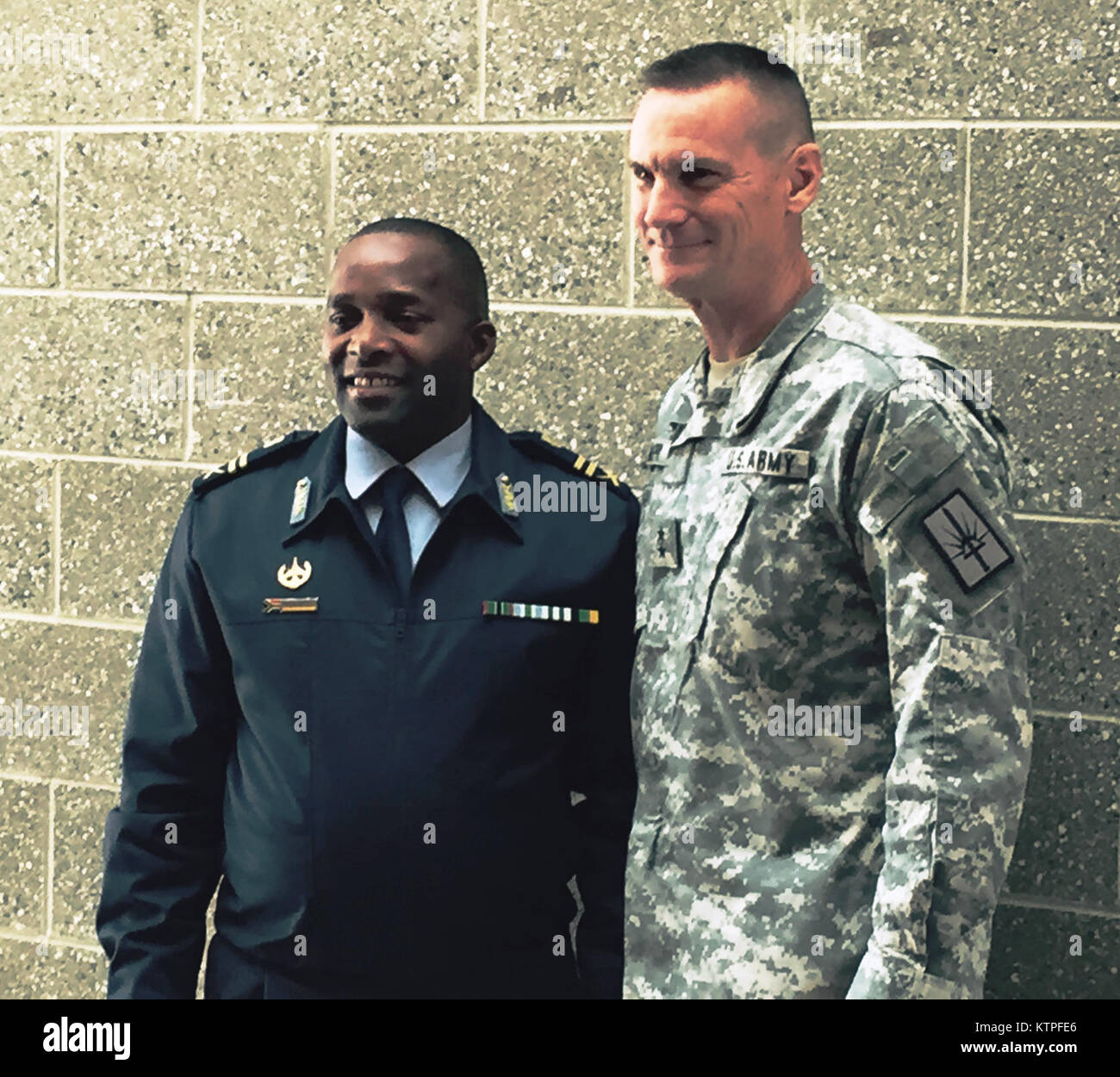 South African Maj. Gen.Wiseman Simo Mbambo center, and Major General Patrick Murphy, the Adjutant General of New York ( right) on Monday, March 2, 2015. Mbomba visited Stewart Air National Guard Base as part of the South African National Defence Force's State Partnership Program relationship with the New York National Guard. (U.S. Army National Guard photo by Major Mark Frank/ Released) Stock Photo