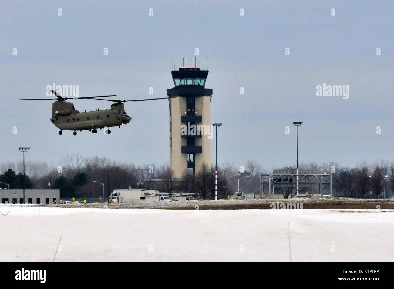 SYRACUSE, NY - Two CH-47 Chinook helicopters from Company B, 3rd Battalion, 126th Aviation located in Rochester, New York land at Hancock Field Air National Guard Base on March 14, 2015. 30 Airmen from the 274th Air Support Operations Squadron (ASOS), based at Hancock Field and the aircrew of two CH-47F Chinook helicopters from Company B, 3rd Battalion, 126th Aviation based at the Army Aviation Support Facility at Rochester International Airport trained together for the first time. The training included Joint Terminal Attack Controller (or JTAC) Airmen from the 274th ASOS conducting CH-47 heli Stock Photo