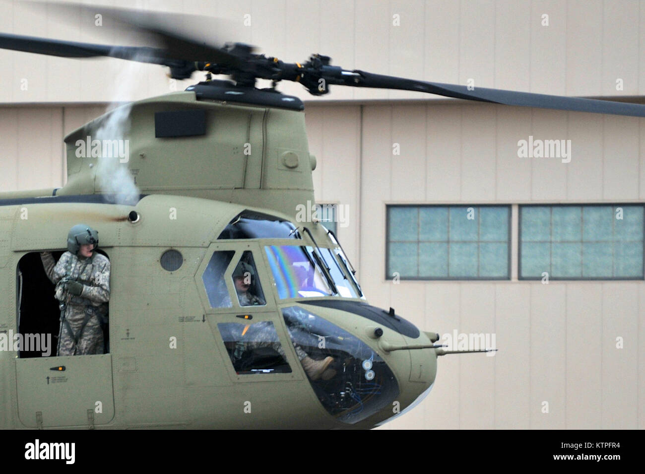 SYRACUSE, NY - Two CH-47 Chinook helicopters from Company B, 3rd Battalion, 126th Aviation located in Rochester, New York land at Hancock Field Air National Guard Base on March 14, 2015. 30 Airmen from the 274th Air Support Operations Squadron (ASOS), based at Hancock Field and the aircrew of two CH-47F Chinook helicopters from Company B, 3rd Battalion, 126th Aviation based at the Army Aviation Support Facility at Rochester International Airport trained together for the first time. The training included Joint Terminal Attack Controller (or JTAC) Airmen from the 274th ASOS conducting CH-47 heli Stock Photo